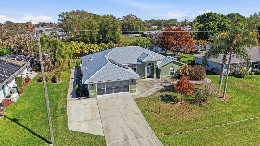 Discover this beautifully maintained 3BR/3BA canal-front pool - Beach Home for sale in Port Saint Lucie, Florida on Beachhouse.com