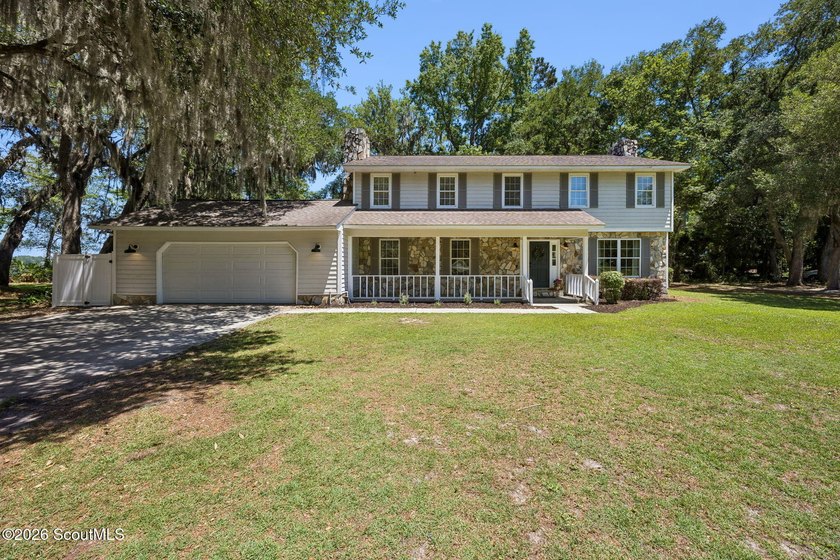 STUNNING VIEWS AWAIT IN THIS TWO-STORY FOUR-BEDROOM HOME TUCKED - Beach Home for sale in Woodbine, Georgia on Beachhouse.com