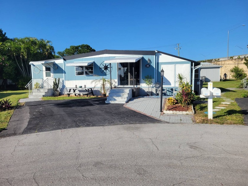 Step into the charm of this adorable vintage-style cottage-a - Beach Home for sale in West Palm Beach, Florida on Beachhouse.com