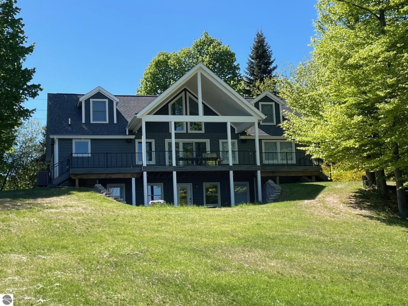 Here is your Torch Lake, turn-key opportunity.  This 5 bedroom 4 - Beach Home for sale in Kewadin, Michigan on Beachhouse.com