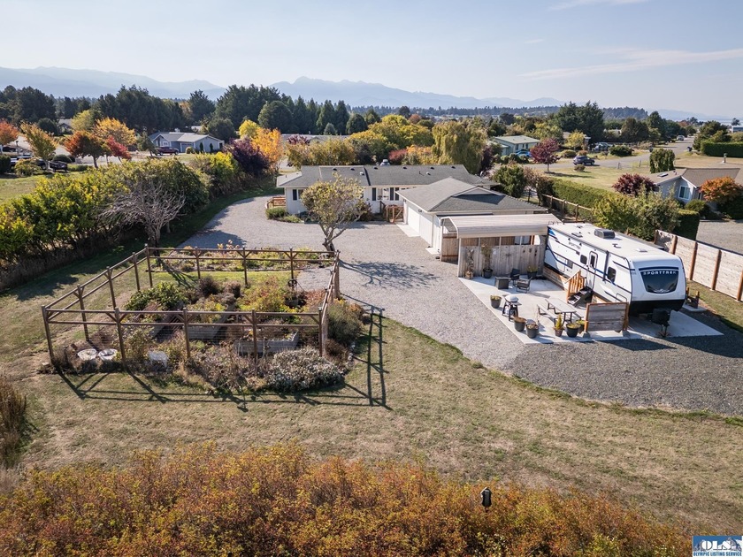 BRAND NEW ROOF! Tucked into a quiet corner of the charming - Beach Home for sale in Sequim, Washington on Beachhouse.com