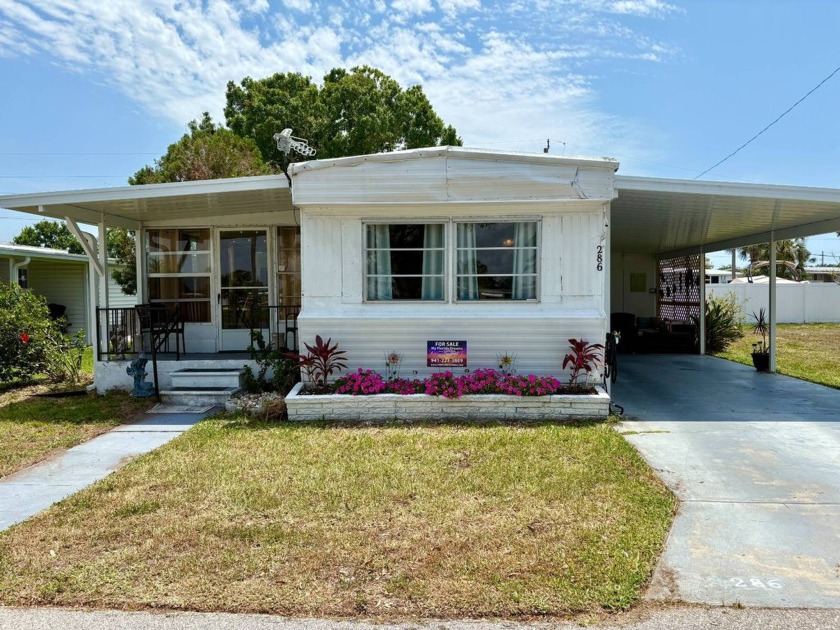 LAKEFRONT LIVING WITH EXCEPTIONAL UPGRADES IN LAKE VILLAGE - Beach Home for sale in Nokomis, Florida on Beachhouse.com