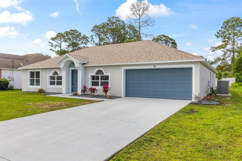 Welcome to 24 Pine Hill Drive, nestled in the serene community - Beach Home for sale in Palm Coast, Florida on Beachhouse.com