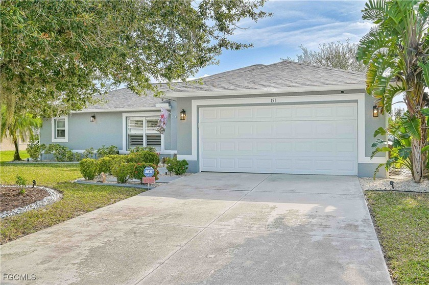 This beautifully updated, heated pool home, is offered mostly - Beach Home for sale in Lehigh Acres, Florida on Beachhouse.com
