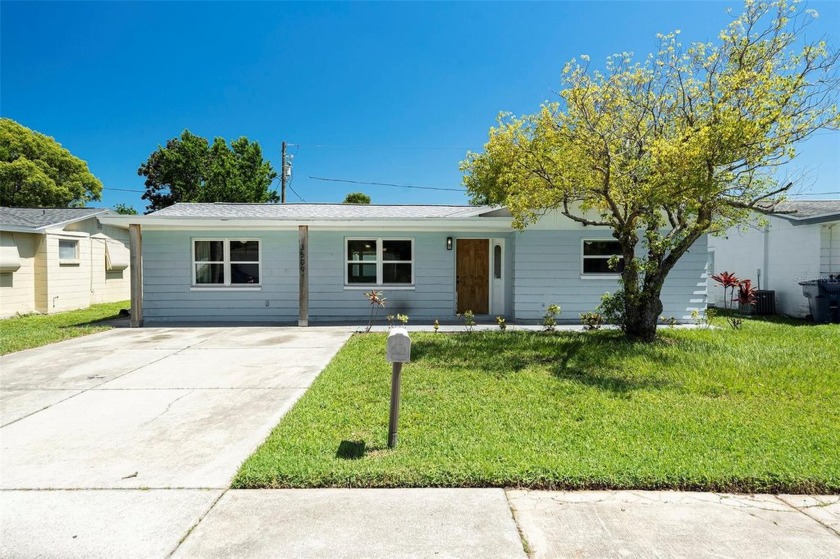 Welcome to this beautifully updated four-bedroom - Beach Home for sale in Holiday, Florida on Beachhouse.com