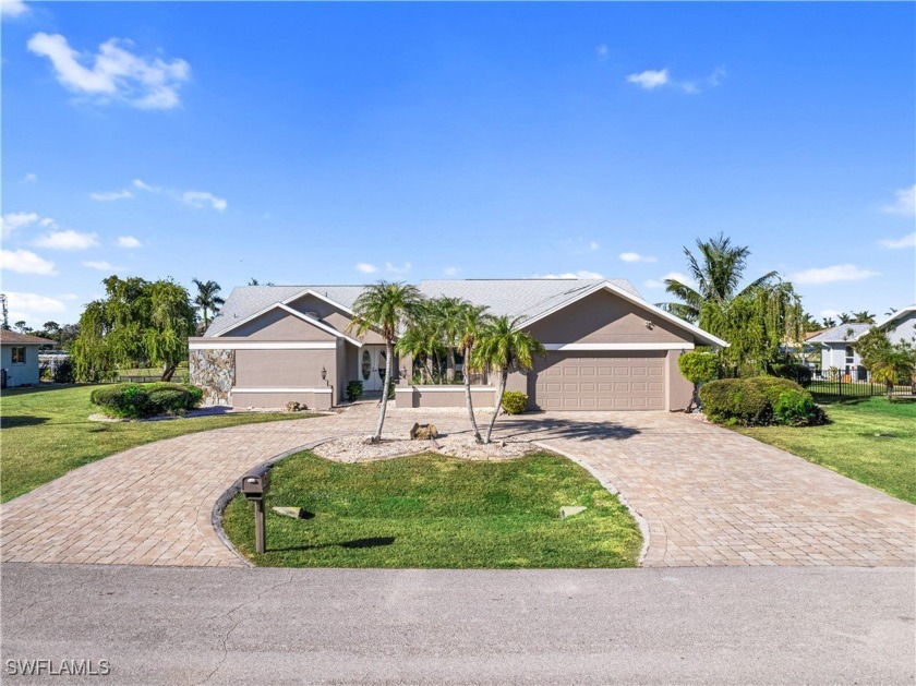 Welcome to 3704 SE 1st Place. Situated on an oversized triple - Beach Home for sale in Cape Coral, Florida on Beachhouse.com