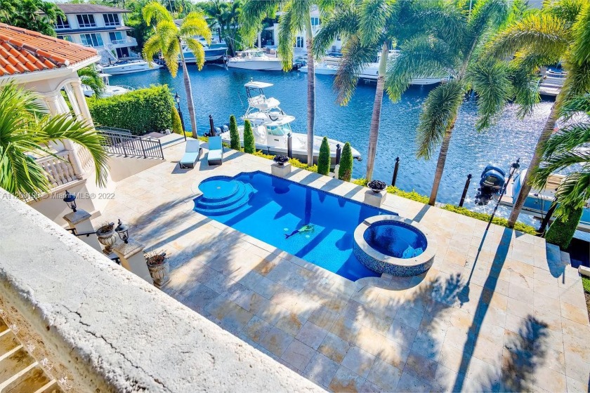 100 Feet of waterfront and no bridge to Bay in the guard gated - Beach Home for sale in Coral  Gables, Florida on Beachhouse.com