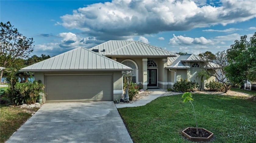 Million dollar views awaits you! Located on beautiful Springlake - Beach Home for sale in Port Charlotte, Florida on Beachhouse.com