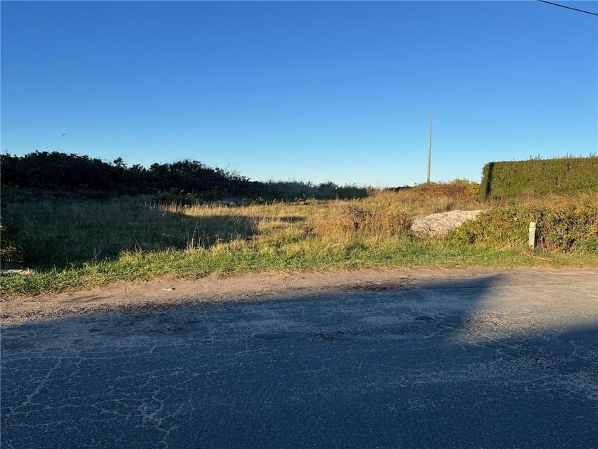 Nestled along a serene shoreline, this vacant lot offers - Beach Lot for sale in Narragansett, Rhode Island on Beachhouse.com