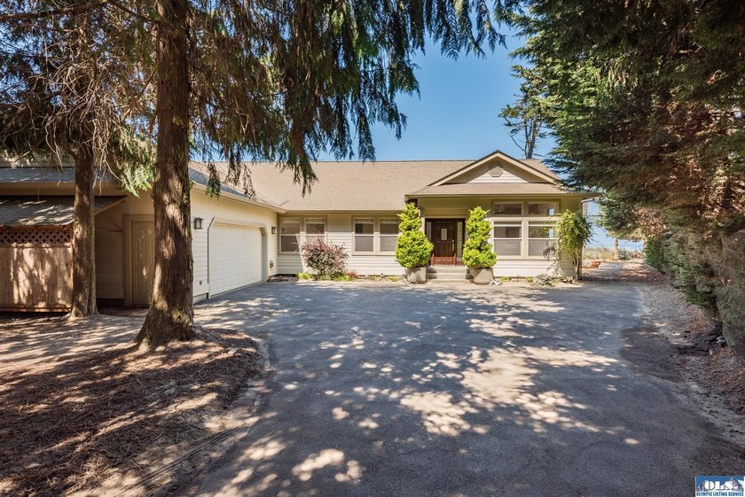 Wind through a tree canopied drive then out into the sunshine - Beach Home for sale in Port Angeles, Washington on Beachhouse.com