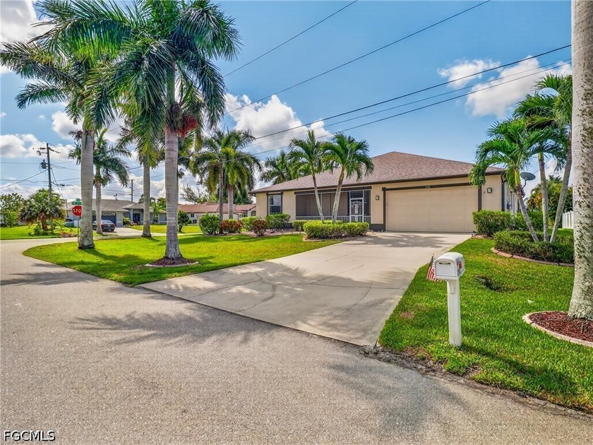 Set on a beautifully MANICURED CORNER LOT lined with stately - Beach Home for sale in Cape Coral, Florida on Beachhouse.com