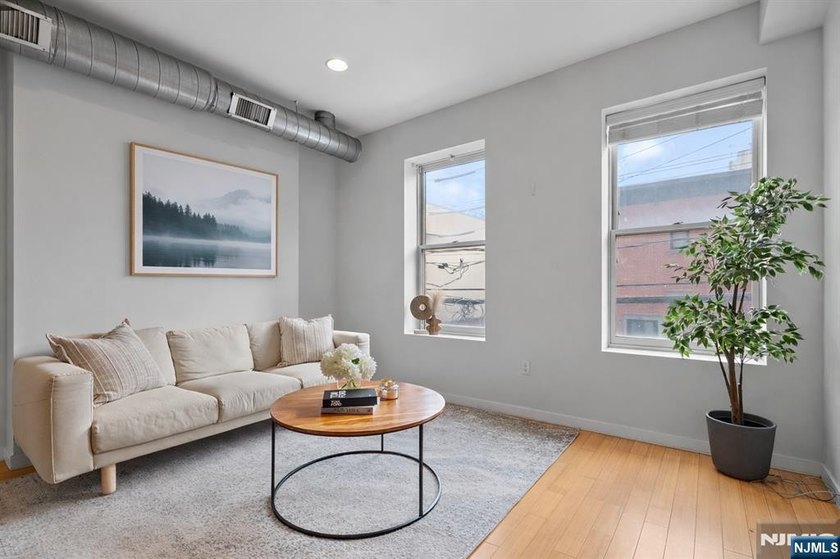 Welcome to this beautifully renovated 2-bedroom, 2-bath corner - Beach Home for sale in Hoboken, New Jersey on Beachhouse.com