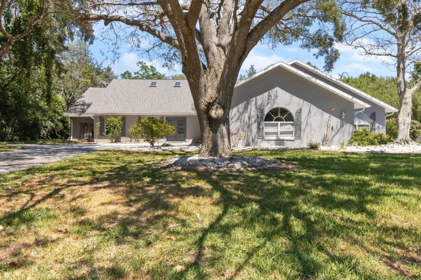 Welcome to your dream home in the prestigious Lake in the Woods - Beach Home for sale in Spring Hill, Florida on Beachhouse.com