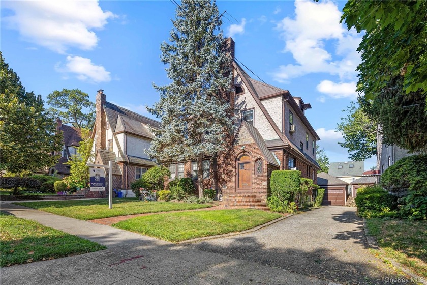 This striking brick and fieldstone Tudor is nestled among lush - Beach Home for sale in Flushing, New York on Beachhouse.com