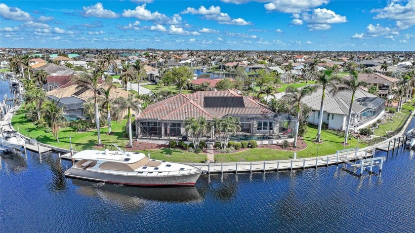 Set on an exclusive tip lot with direct sailboat access to - Beach Home for sale in Punta Gorda, Florida on Beachhouse.com