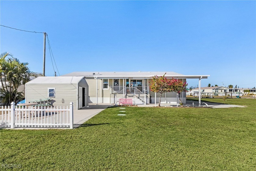 This stunning elevated triple-wide Jacobsen manufactured home - Beach Home for sale in St. James City, Florida on Beachhouse.com
