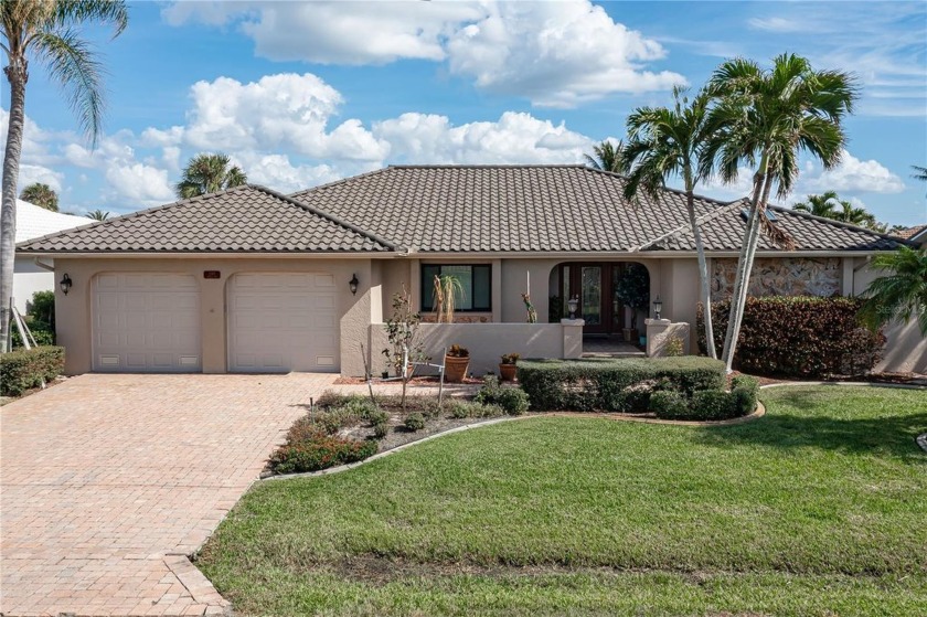 UPDATED, PGI WATERFRONT HOME W/**NEW METAL ROOF**, 90 FT OF - Beach Home for sale in Punta Gorda, Florida on Beachhouse.com