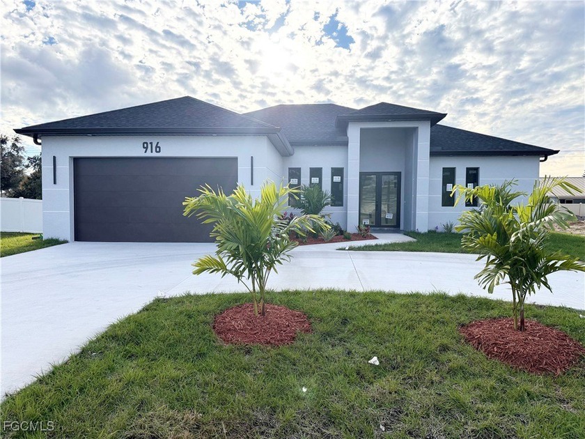 This beautiful new construction home featuring 3 bedrooms, 2 - Beach Home for sale in Cape Coral, Florida on Beachhouse.com