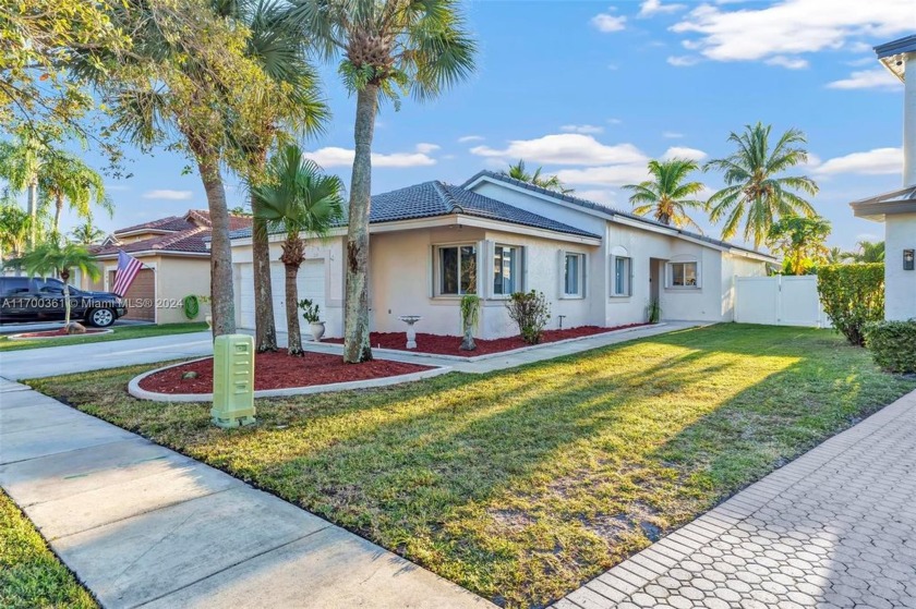 Beautifully maintained 4-bedroom, 2-bathroom one-story home with - Beach Home for sale in Pembroke Pines, Florida on Beachhouse.com