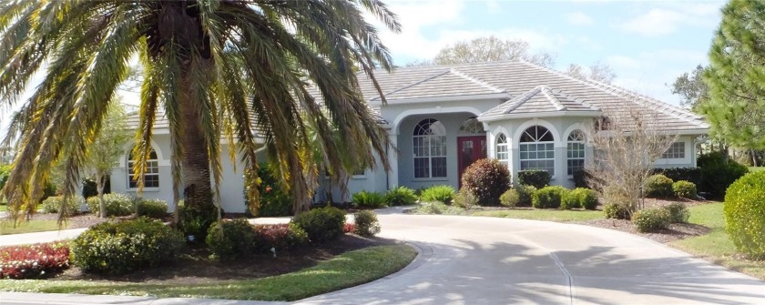 This custom-built home has gorgeous wide golf and water views of - Beach Home for sale in Nokomis, Florida on Beachhouse.com