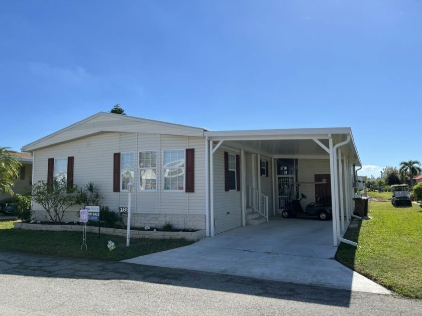 This lakefront home is simply beautiful and the view is - Beach Home for sale in Punta Gorda, Florida on Beachhouse.com