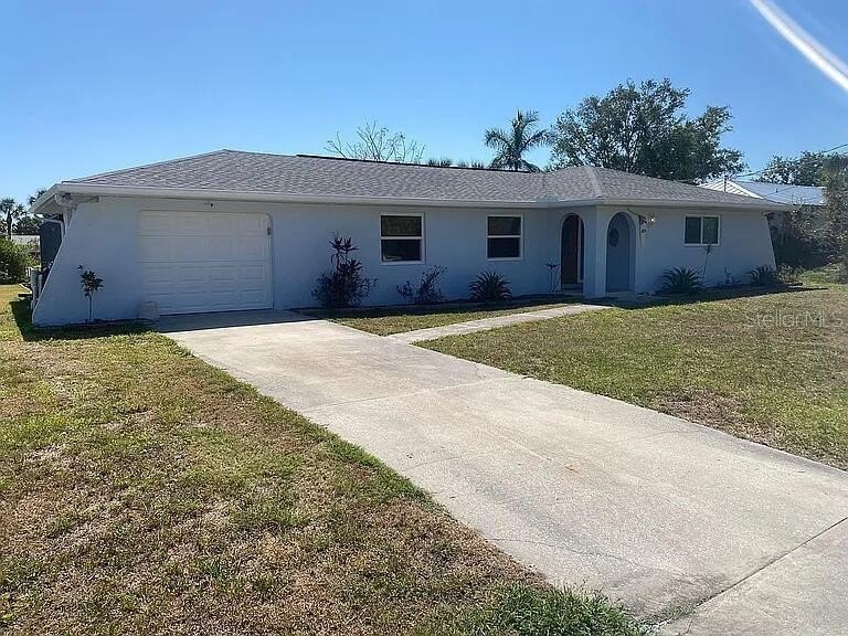 Freshly remodeled home with a large heated swimming pool on a - Beach Home for sale in Port Charlotte, Florida on Beachhouse.com