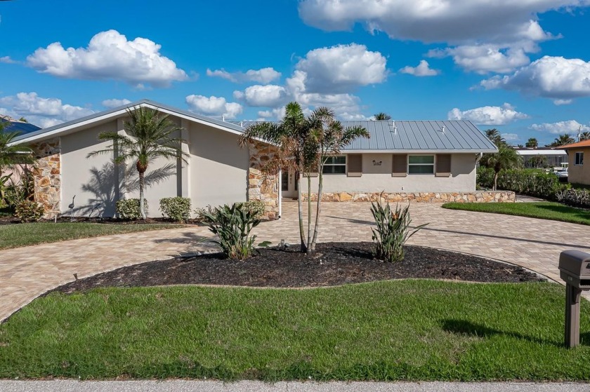 WATERFRONT HOME W/80 FT OF SEAWALL, METAL ROOF, IMPACT WINDOWS - Beach Home for sale in Punta Gorda, Florida on Beachhouse.com