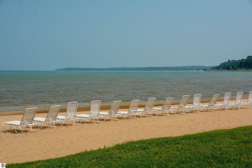 Condo with 200' of shared Grand Traverse Bay waterfront! Fully - Beach Condo for sale in Traverse City, Michigan on Beachhouse.com