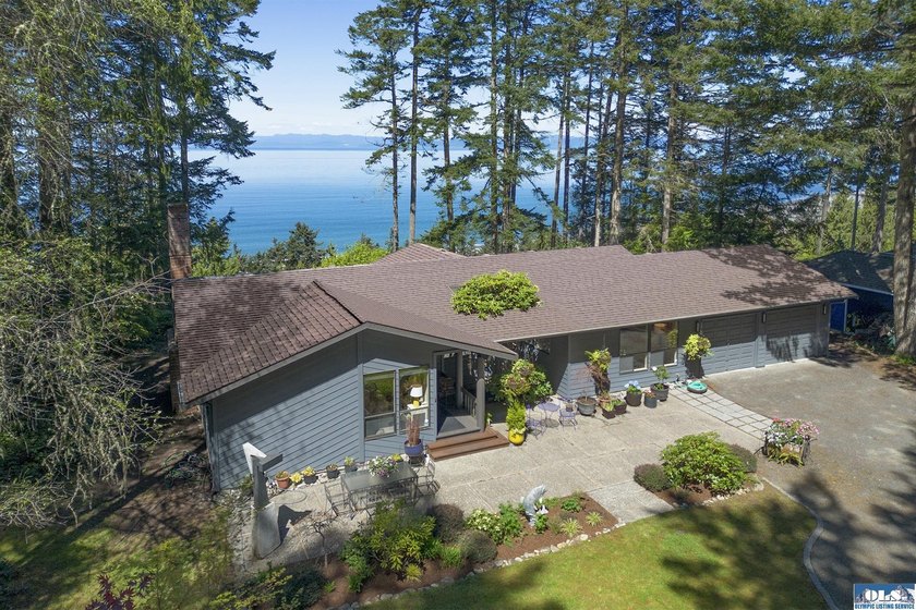 Set along a tree-lined driveway and surrounded by evergreens - Beach Home for sale in Port Angeles, Washington on Beachhouse.com