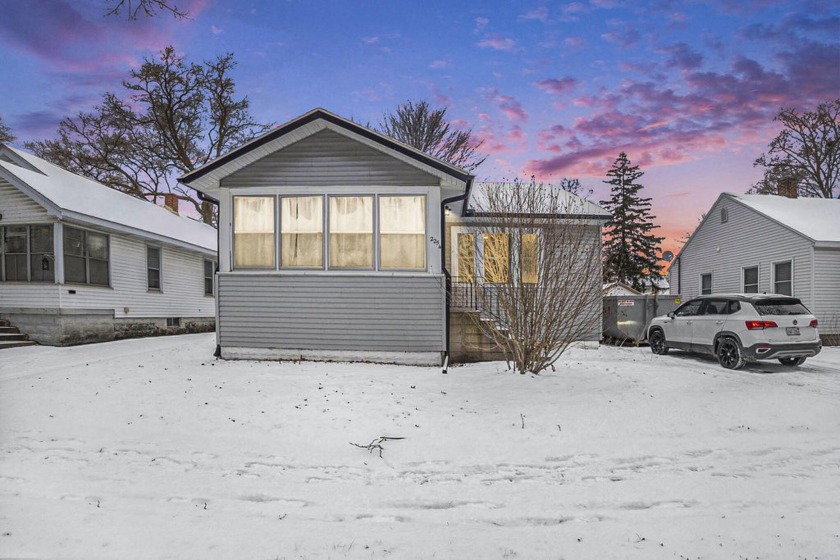 This inviting 2-bedroom, 1-bathroom home offers a blend of - Beach Home for sale in Muskegon, Michigan on Beachhouse.com