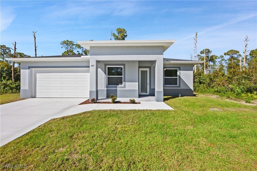 This bright, NEWLY BUILT HOME features a spacious open-concept - Beach Home for sale in Lehigh Acres, Florida on Beachhouse.com