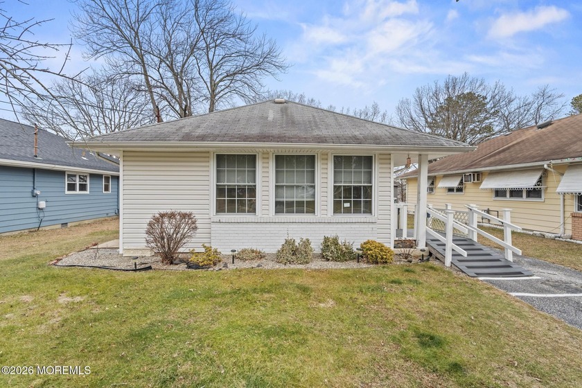 Approach this home via a low-maintenance composite deck with a - Beach Home for sale in Toms River, New Jersey on Beachhouse.com
