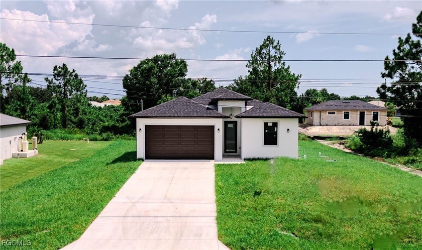 Don't miss this brand-new construction home located just minutes - Beach Home for sale in Lehigh Acres, Florida on Beachhouse.com