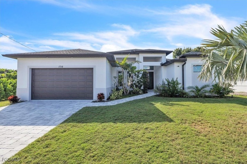 Discover this stunning new construction located in the heart of - Beach Home for sale in Cape Coral, Florida on Beachhouse.com