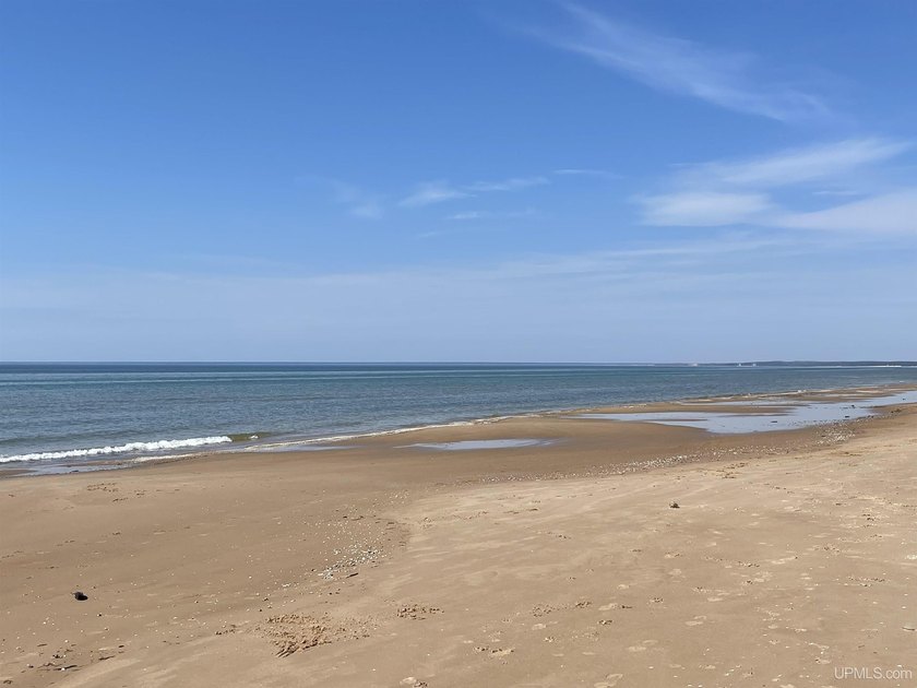 Offering 1,396 feet of exceptional Lake Michigan frontage and 47 - Beach Acreage for sale in Gulliver, Michigan on Beachhouse.com
