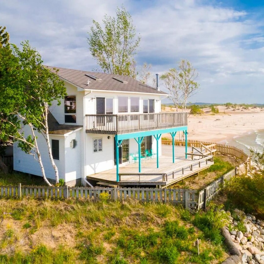 Nestled along the shoreline of Lake Michigan, this inviting - Beach Home for sale in Mears, Michigan on Beachhouse.com
