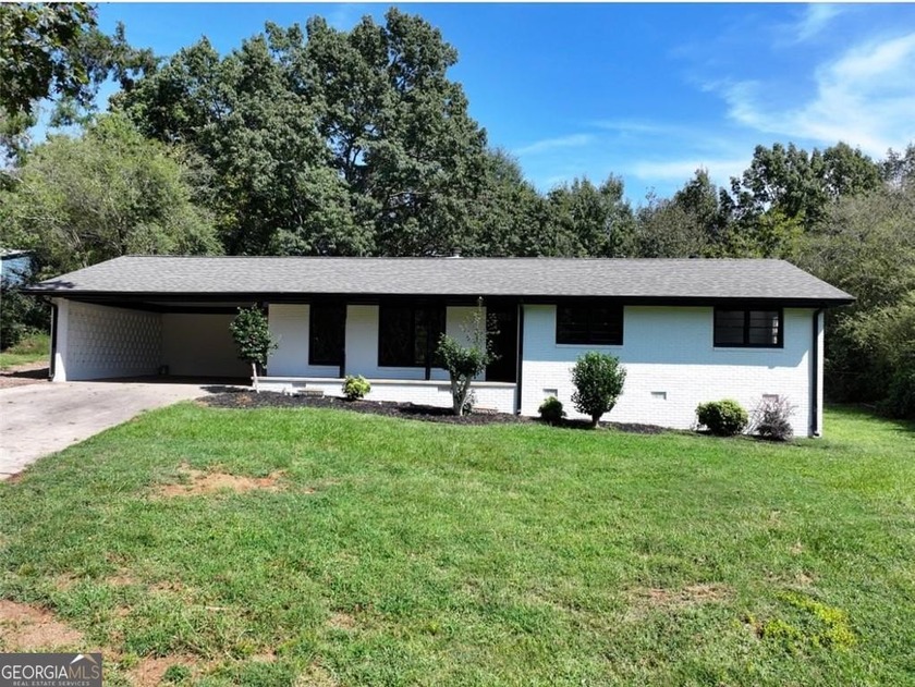 This beautifully renovated ranch-style home combines minimalist - Beach Home for sale in Gainesville, Georgia on Beachhouse.com