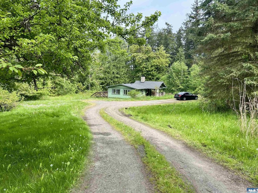 Tucked away in the quiet Gardiner area, just a short walk from - Beach Home for sale in Sequim, Washington on Beachhouse.com