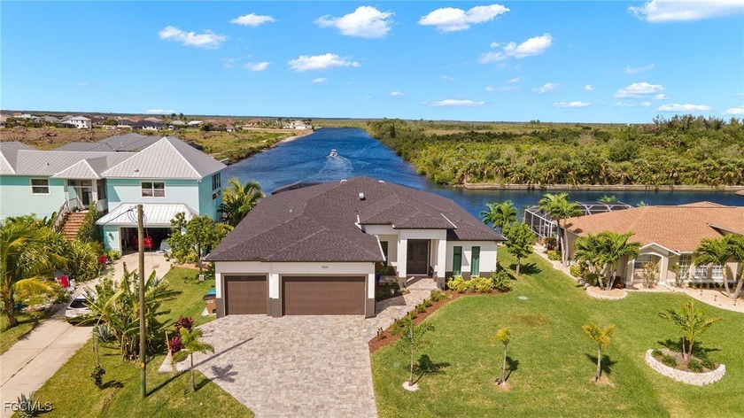 Step into this extraordinary 2021 built custom home and you'll - Beach Home for sale in Cape Coral, Florida on Beachhouse.com