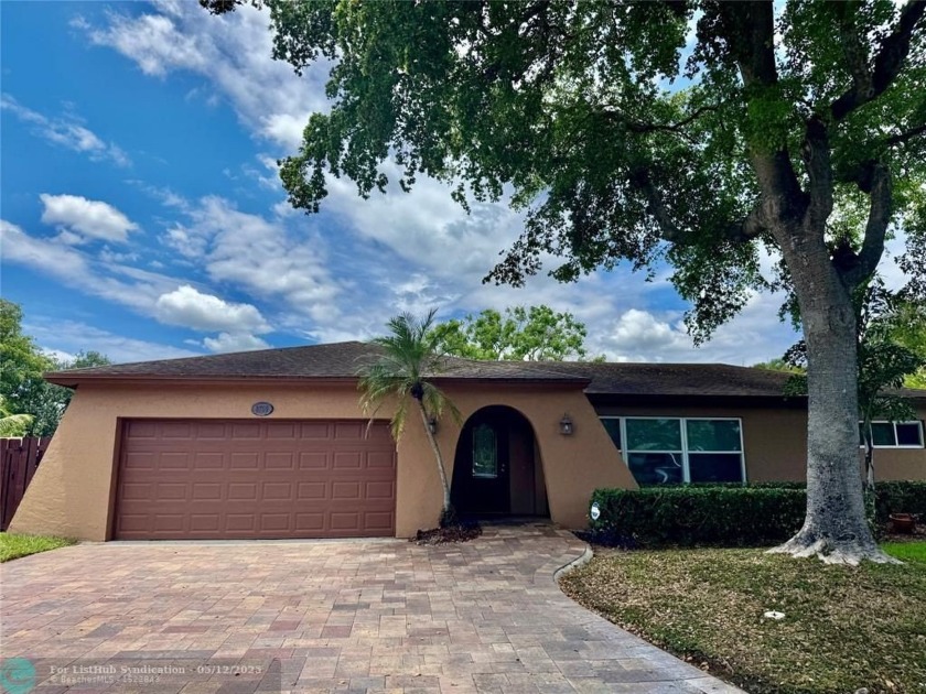 This spacious 4-bedroom, 2-bath home is located on a quiet - Beach Home for sale in Cooper City, Florida on Beachhouse.com