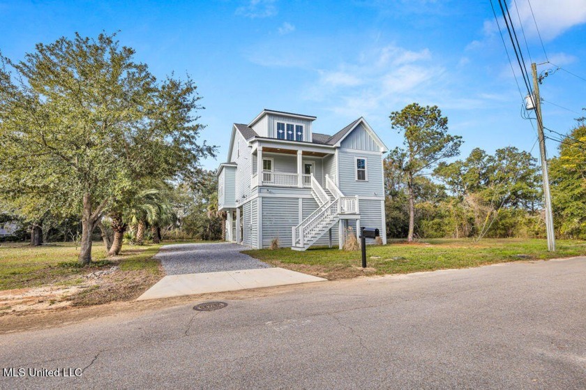 This coastal retreat is nestled among the oaks of Pass Christian - Beach Home for sale in Pass Christian, Mississippi on Beachhouse.com