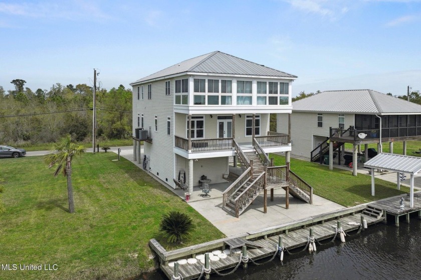 Experience waterfront luxury living at its finest! Step into - Beach Home for sale in Bay Saint Louis, Mississippi on Beachhouse.com