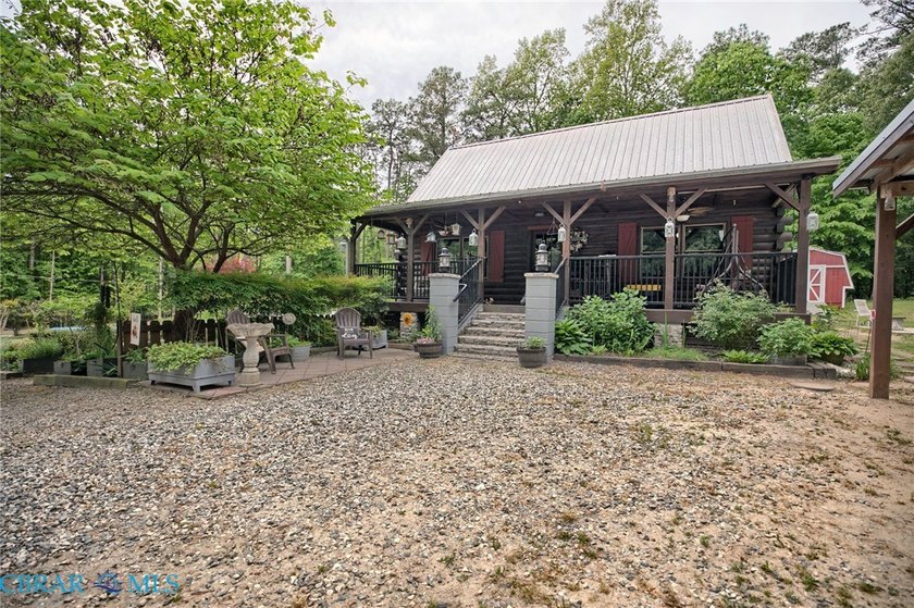 Country Cabin retreat! Tucked away on a private lane, this - Beach Home for sale in Gloucester, Virginia on Beachhouse.com