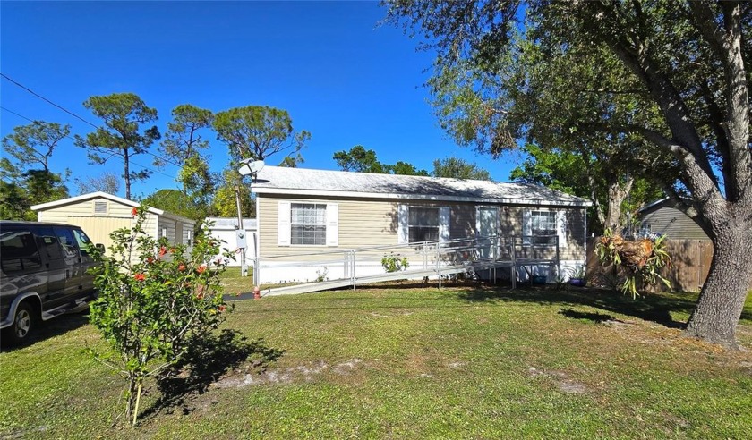 Welcome home to this 2005 manufactured home located on a - Beach Home for sale in Punta Gorda, Florida on Beachhouse.com