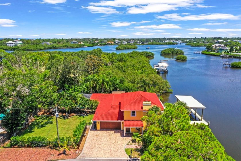 Nestled on a lot and a half along the serene waters of - Beach Home for sale in Palm Harbor, Florida on Beachhouse.com
