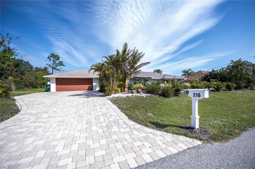 SERENITY  PRIVACY AWAITS...this WATERFRONT custom 4/3/2 POOL - Beach Home for sale in Rotonda West, Florida on Beachhouse.com