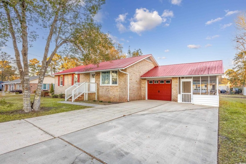 Welcome home to this all brick 3 bedroom 2 bath home with a - Beach Home for sale in Myrtle Beach, South Carolina on Beachhouse.com