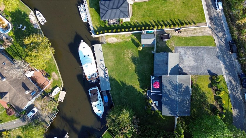 Welcome to waterfront living at its finest. Situated in - Beach Home for sale in Oakdale, New York on Beachhouse.com