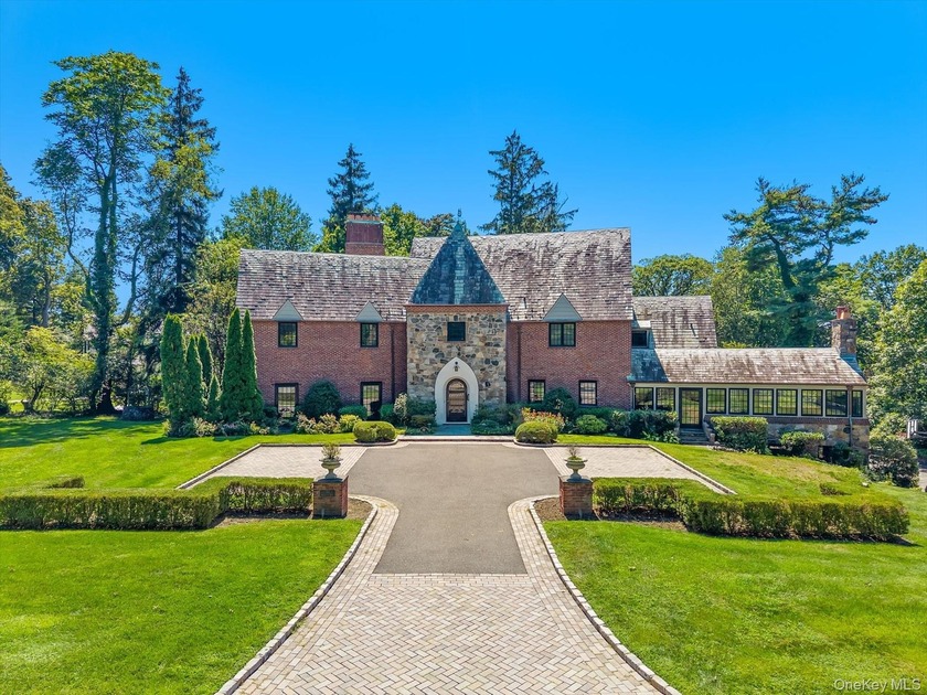Step into timeless elegance with this one-of-a-kind Tudor - Beach Home for sale in Great Neck, New York on Beachhouse.com