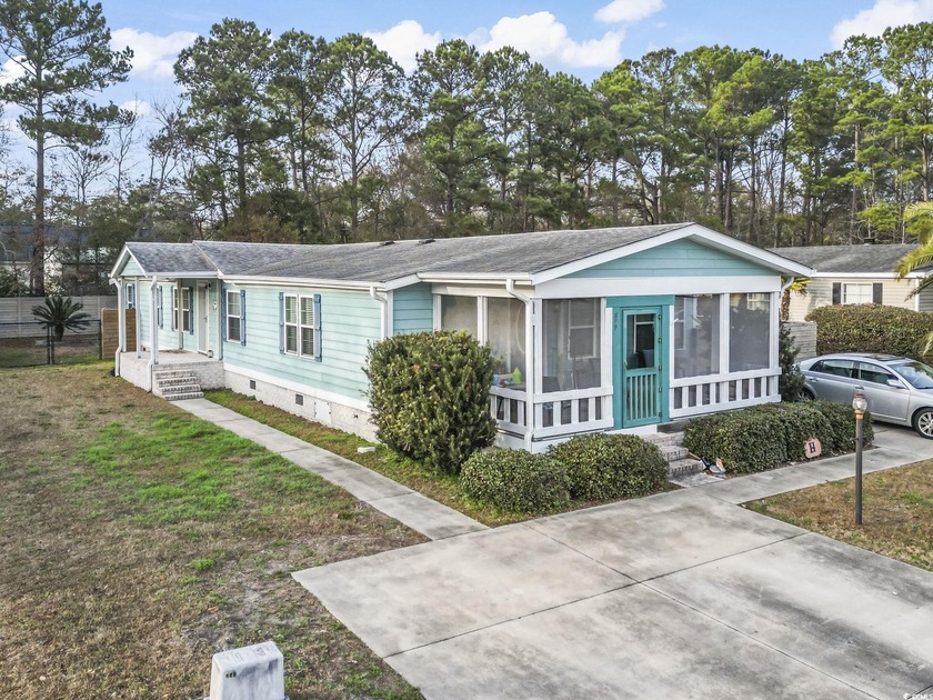 Perfectly positioned where the marsh meets the sea, this - Beach Home for sale in Murrells Inlet, South Carolina on Beachhouse.com